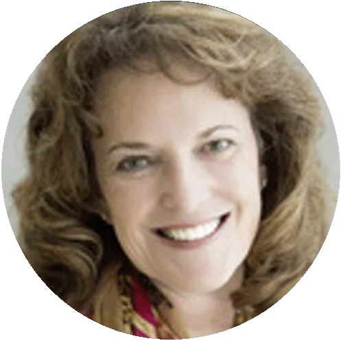 Smiling woman with curly hair, representing confidence and clarity.